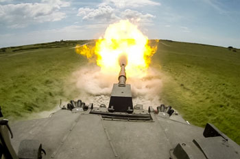 View from on top of a tank as it is firing