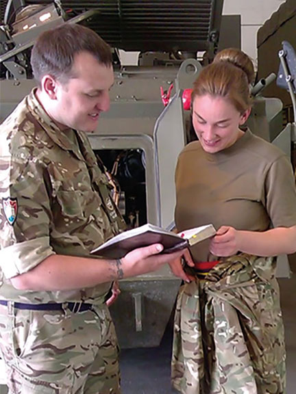 Scripture Reader showing Bible passage to a service member