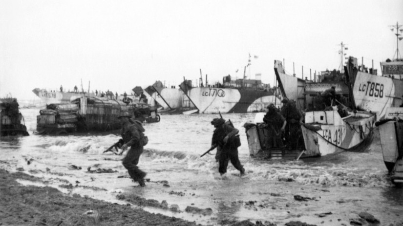 Commandos wading ashore from landing craft, onto the beaches of Normandy, June 1944. © Crown copyright