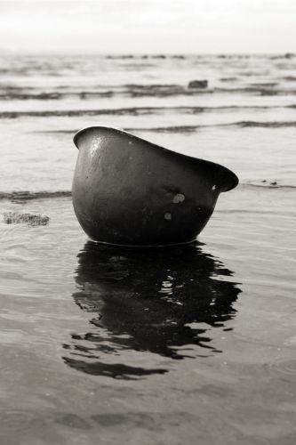 Helmet washing up on the beach.