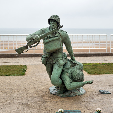 Soldier Statue memorial on Omaha Beach. Public Domain Image.