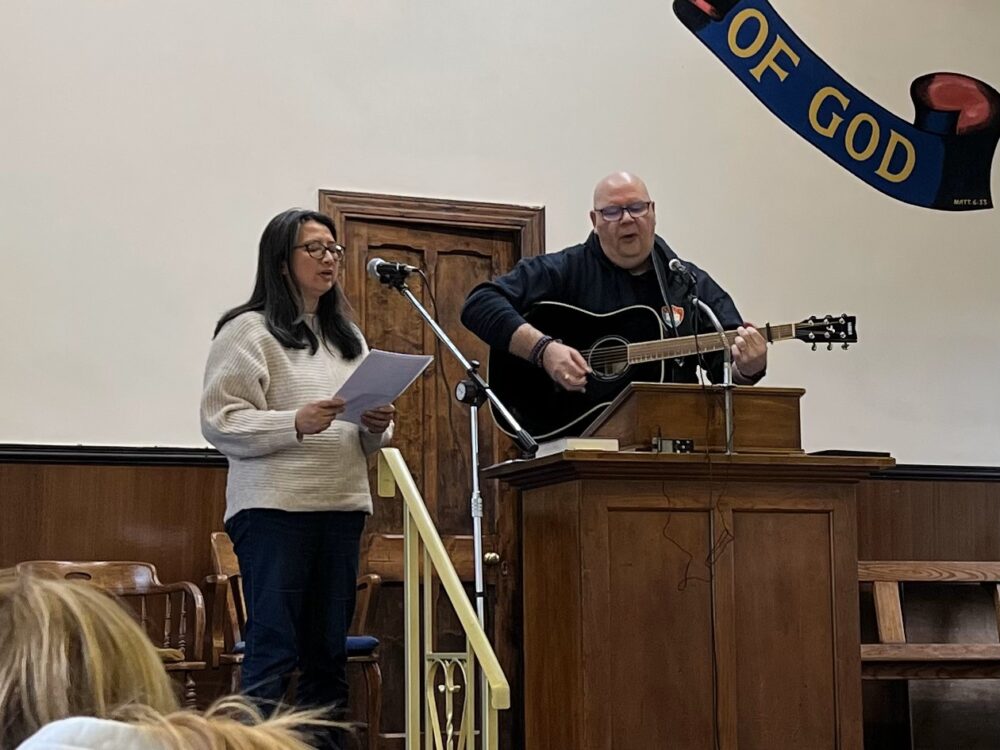 David and Laiyee sharing a song of praise and trust at their commissioning service